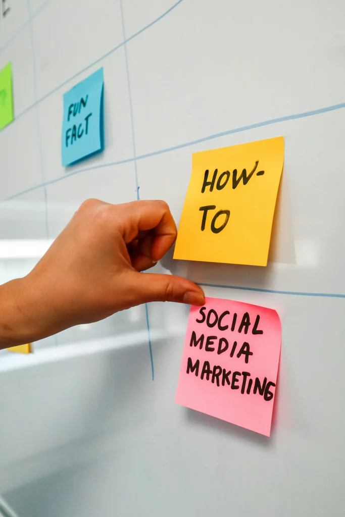 Social media marketing strategy written on sticky notes with how-to and key planning steps